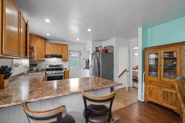a kitchen with a refrigerator and cabinets
