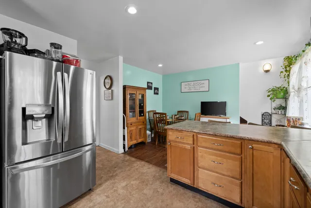 a dining room with furniture and wooden floor