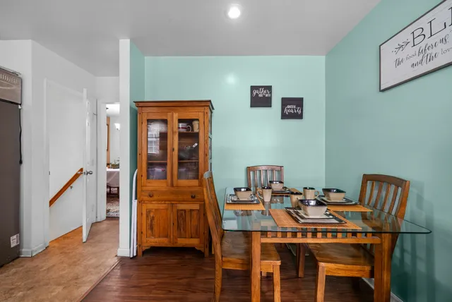 a bathroom with a tub a sink and a large mirror
