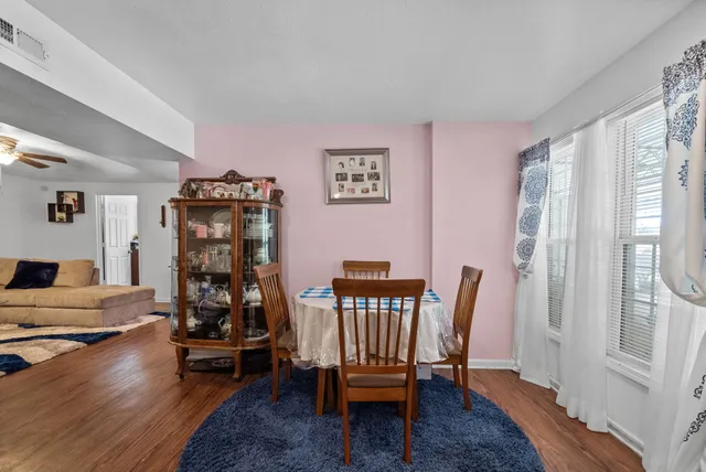 a bedroom with bed and glass door