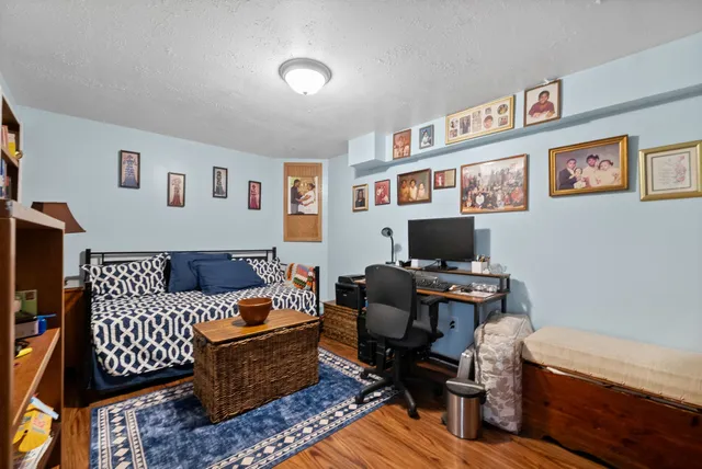 a view of an outdoor dining space with a table and chairs