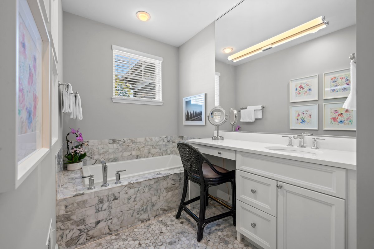 828 Chestnut Street Deerfield, IL 60015 - Photo 12 of 29 a bath room with a sink and a mirror