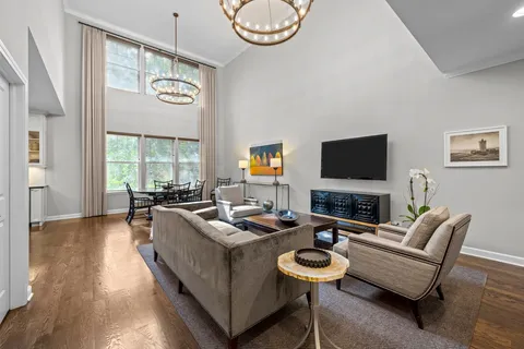 a living room with fireplace furniture and a flat screen tv