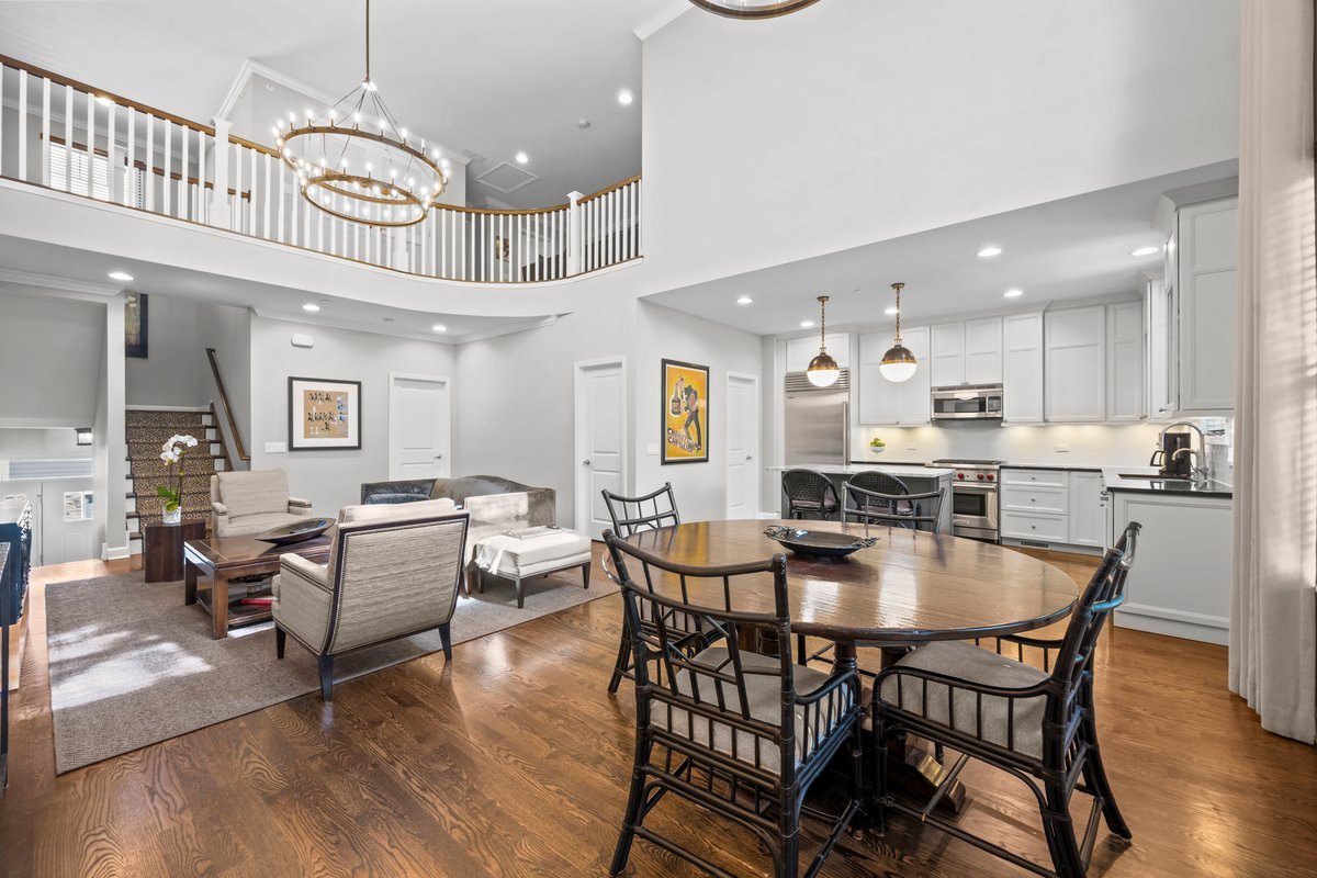 828 Chestnut Street Deerfield, IL 60015 - Photo 5 of 29 a dining room with wooden floor a chandelier a wooden table and chairs