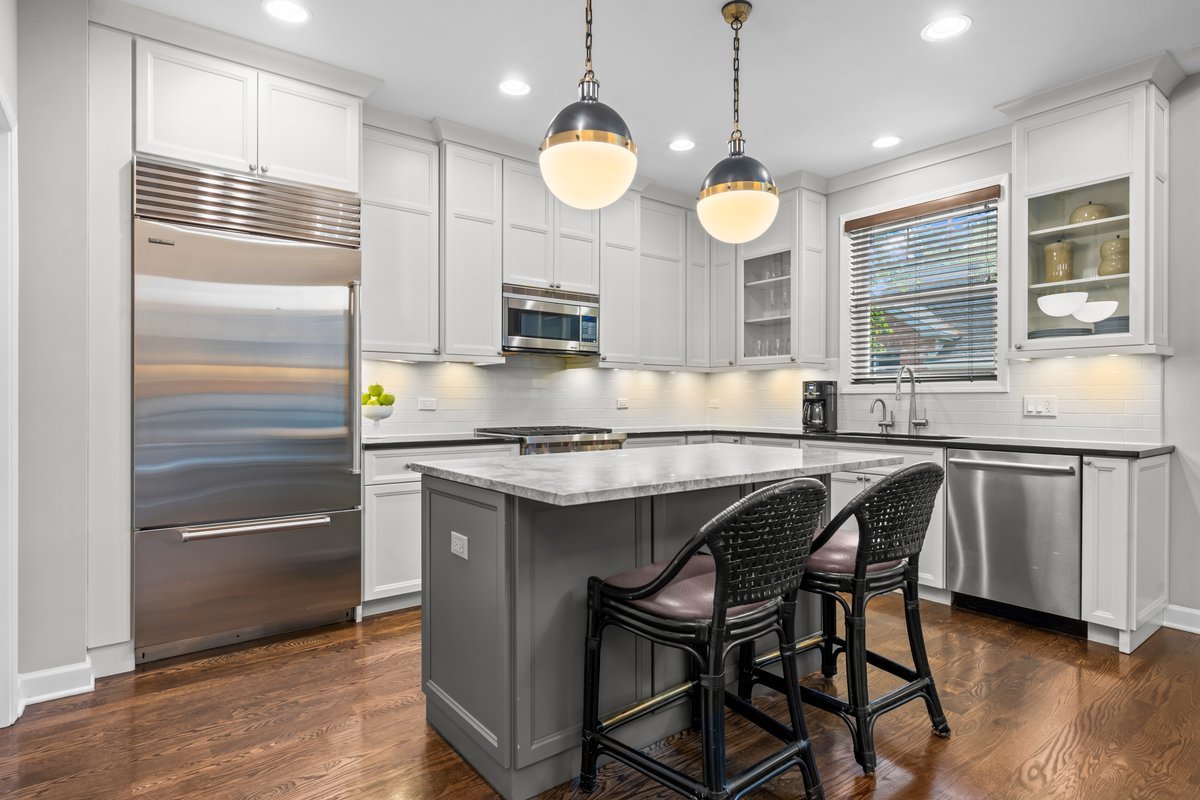 828 Chestnut Street Deerfield, IL 60015 - Photo 7 of 29 a kitchen with cabinets a center island and stainless steel appliances