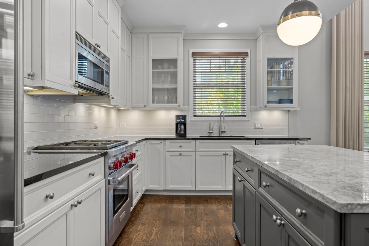 828 Chestnut Street Deerfield, IL 60015 - Photo 8 of 29 a kitchen with granite countertop cabinets stainless steel appliances a sink and a window