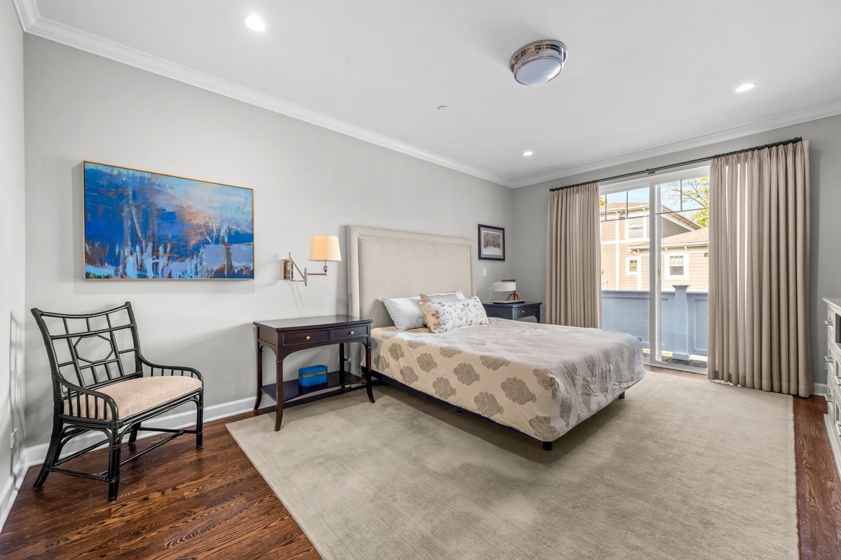 828 Chestnut Street Deerfield, IL 60015 - Photo 10 of 29 a bedroom with a bed a table and painting