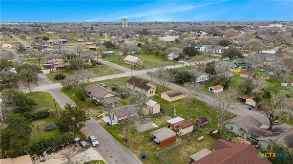 an aerial view of residential houses with outdoor space