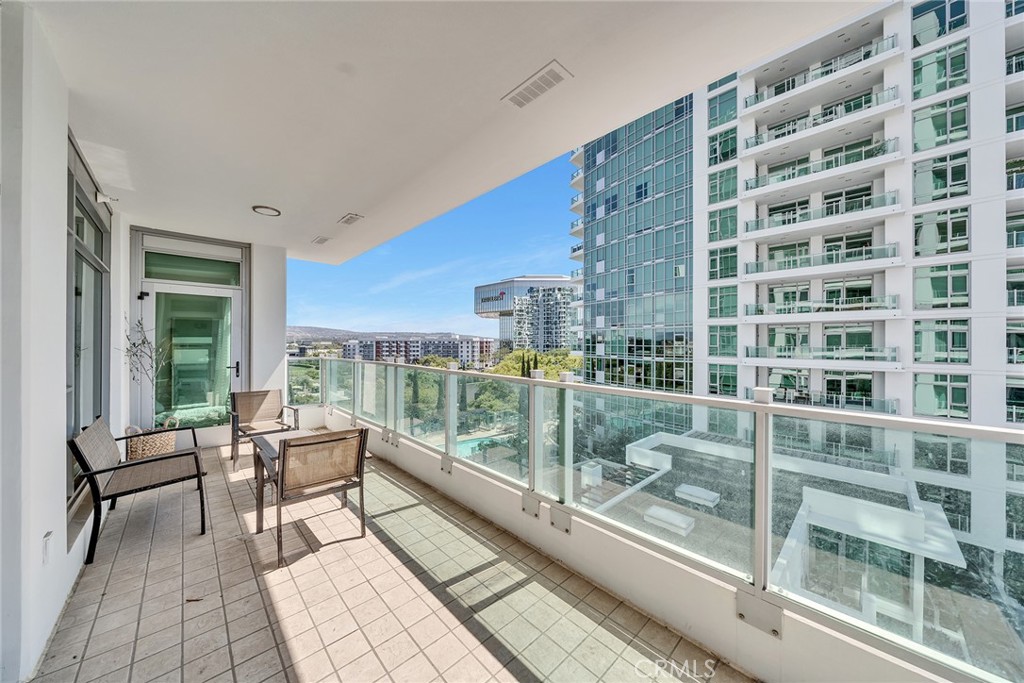3141 Michelson Drive, Unit 707 Irvine, CA 92612 - Photo 31 of 31 a view of a balcony with chair and table