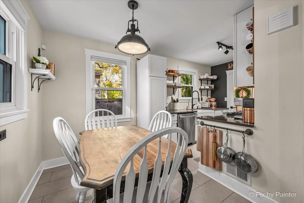 625 South Harrison Street Batavia, IL 60510 - Photo 11 of 43 a view of a dining room with furniture a chandelier and wooden floor