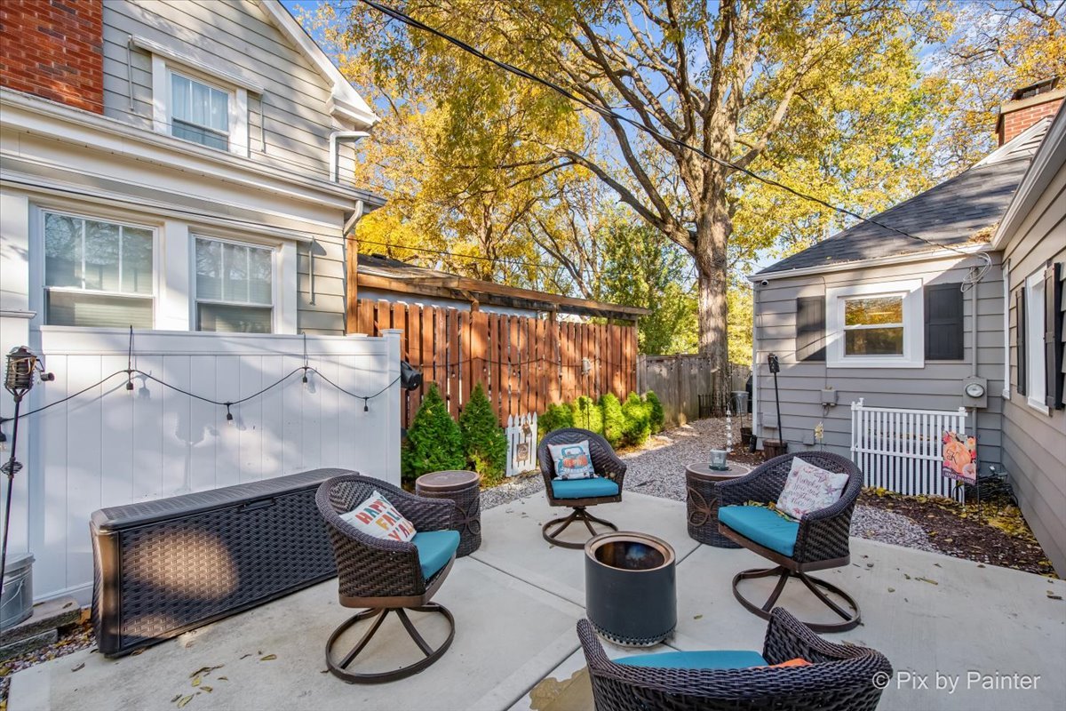 625 South Harrison Street Batavia, IL 60510 - Photo 23 of 43 a view of a patio with couches table and chairs and potted plants