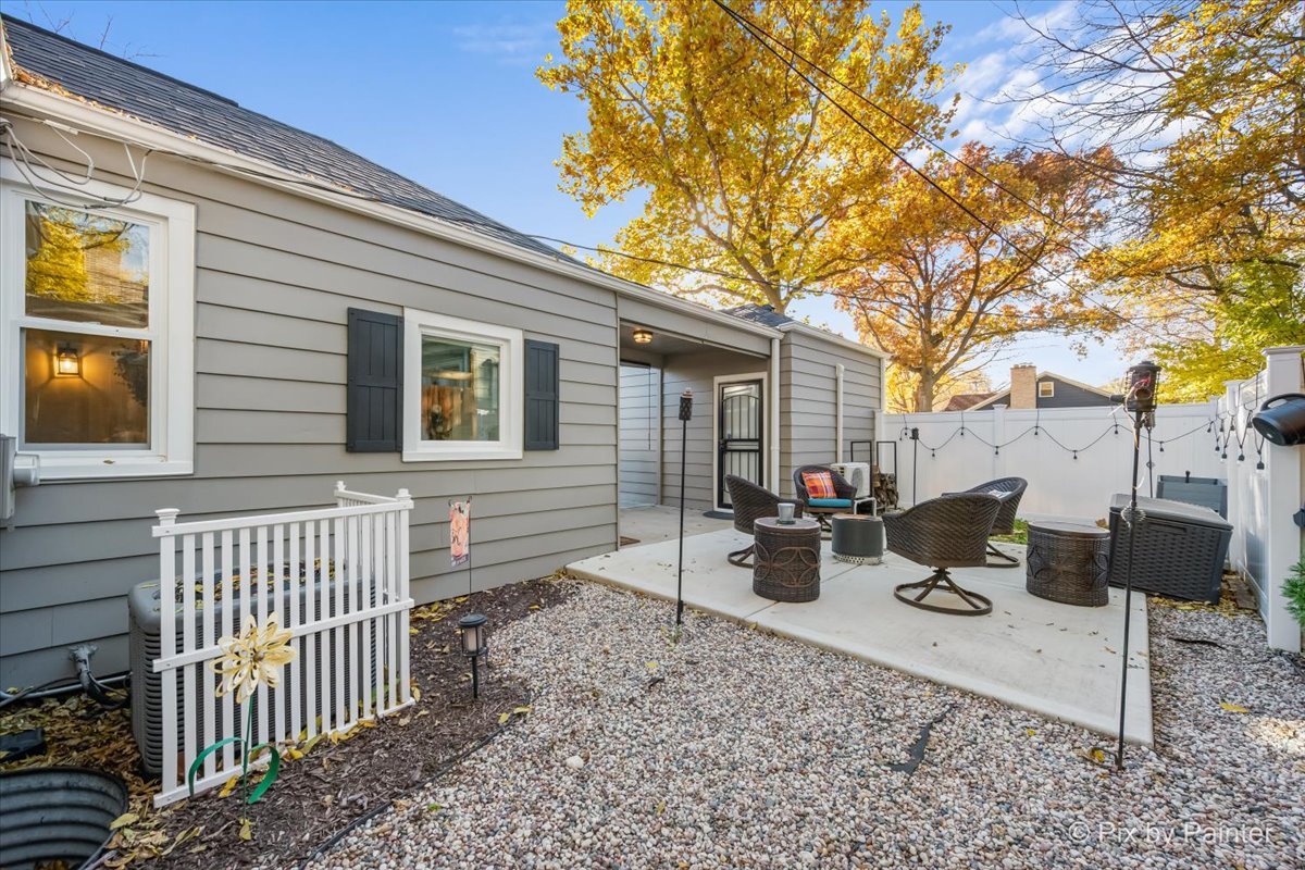 625 South Harrison Street Batavia, IL 60510 - Photo 28 of 43 a view of a chairs and table in backyard
