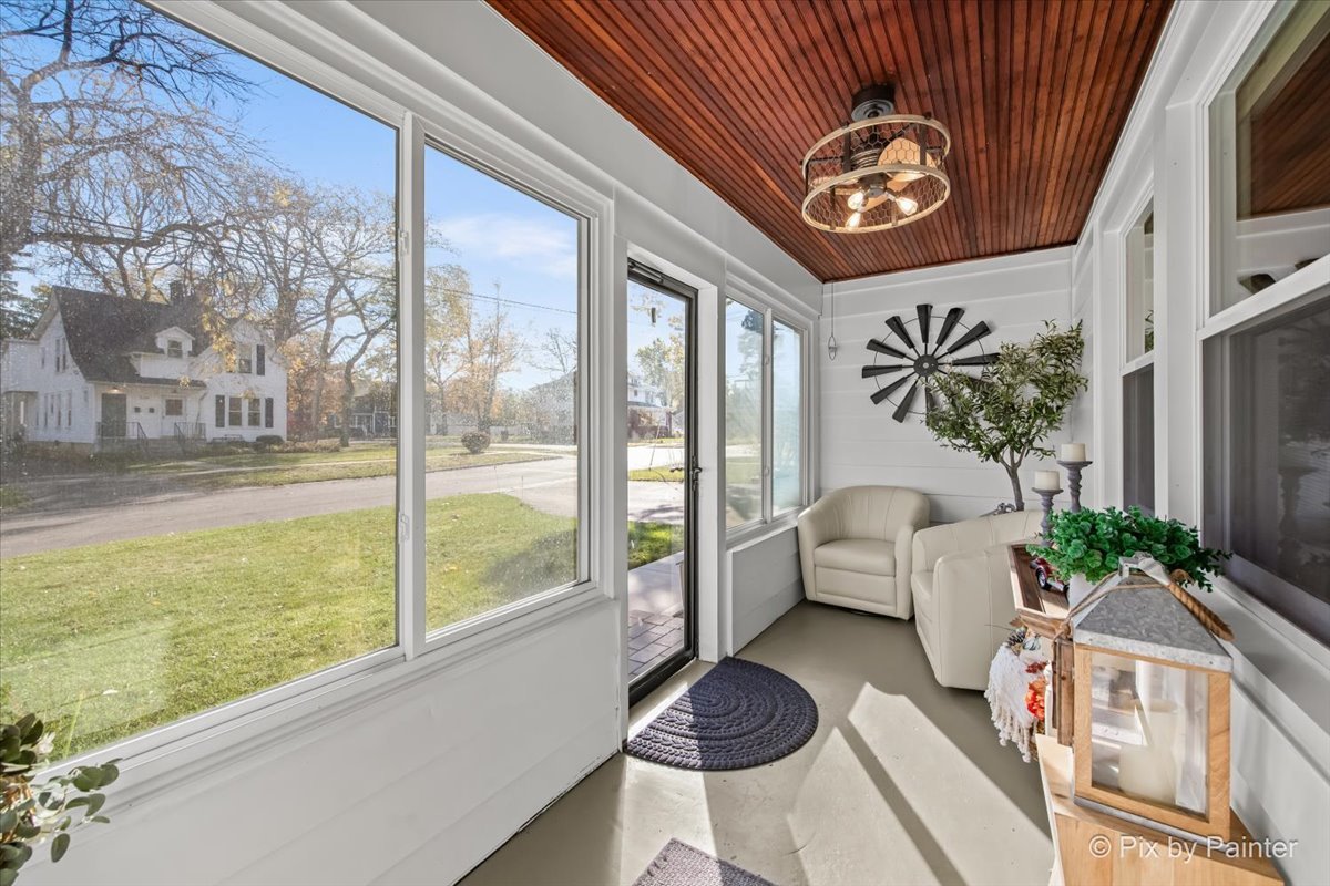 625 South Harrison Street Batavia, IL 60510 - Photo 3 of 43 a living room with furniture and a floor to ceiling window