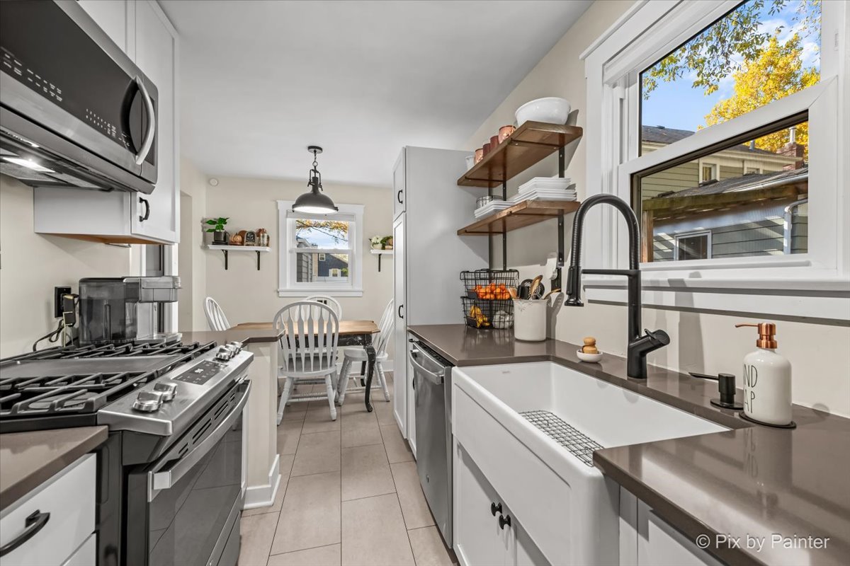 625 South Harrison Street Batavia, IL 60510 - Photo 10 of 43 a kitchen with a stove and a sink