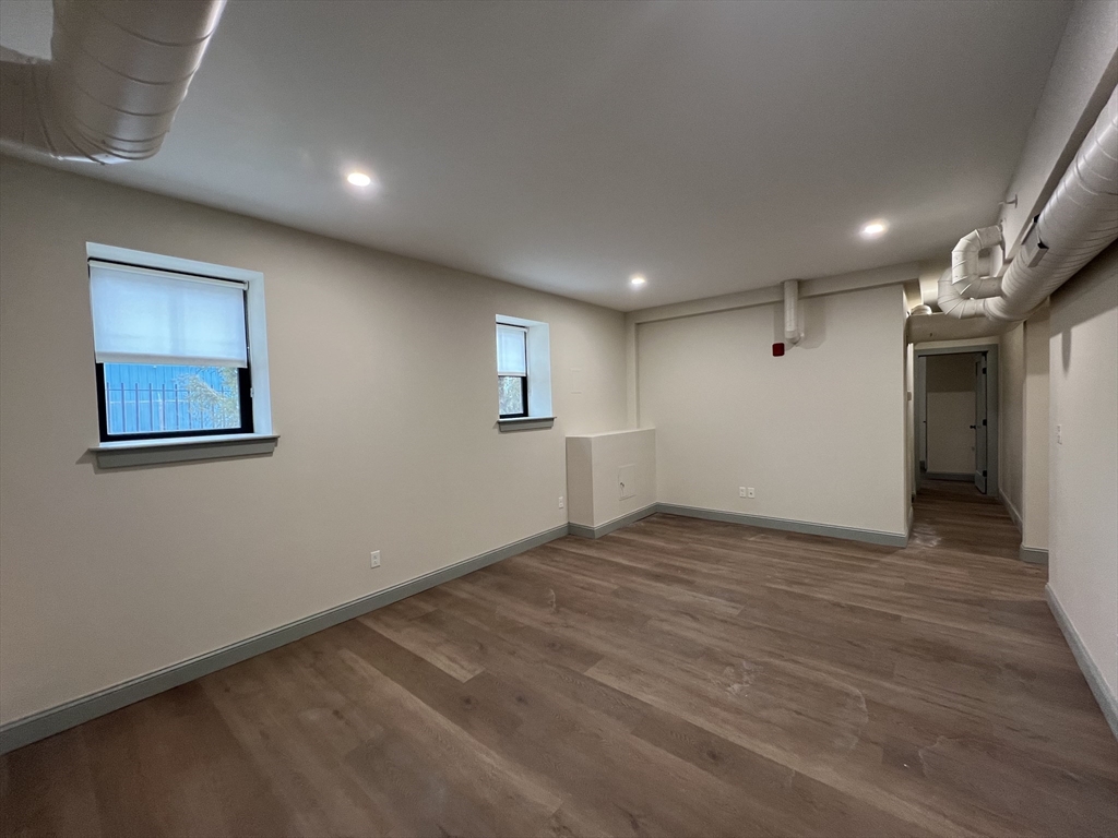 160 Seabury Street, Unit 3 Fall River, MA 02720 - Photo 6 of 12 a view of empty room with wooden floor