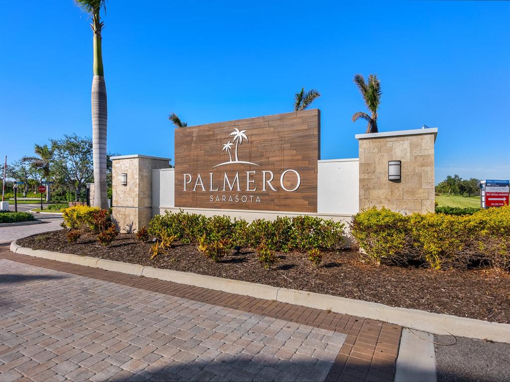 15317 Isla Palma Lane Nokomis, FL 34275 - Photo 21 of 25 a sign on the side of a building