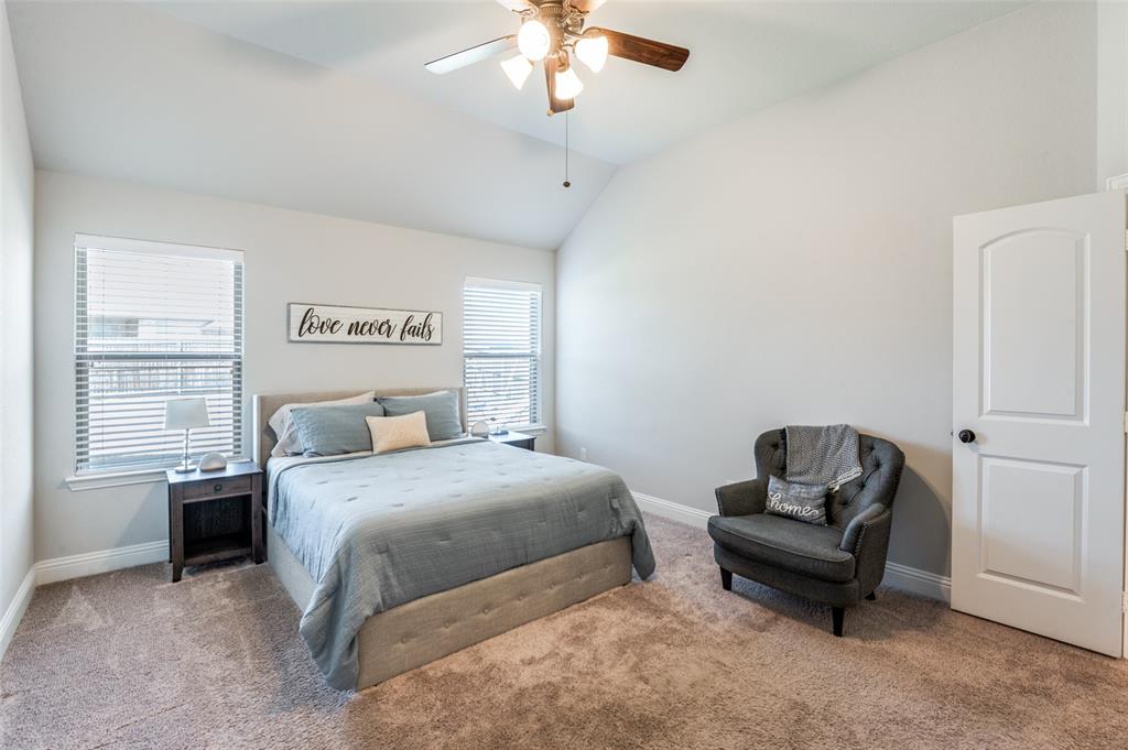 3011 Razorback Street Melissa, TX 75454 - Photo 16 of 25 a bedroom with a bed and a couch