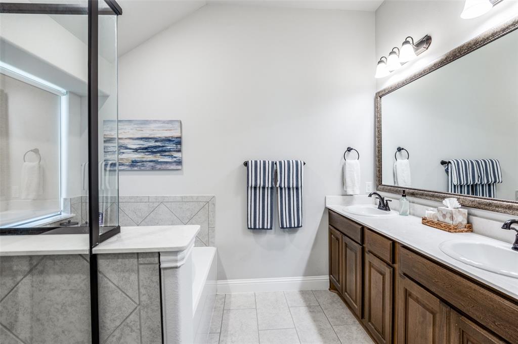 3011 Razorback Street Melissa, TX 75454 - Photo 19 of 25 a bathroom with a sink and a mirror