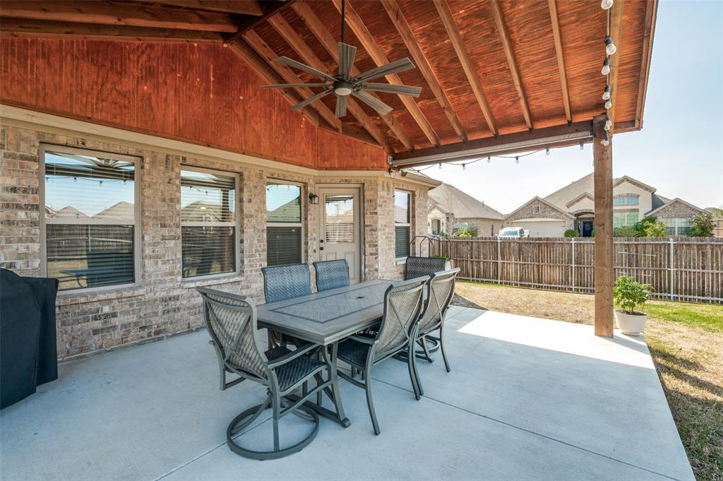 3011 Razorback Street Melissa, TX 75454 - Photo 22 of 25 a dining room with furniture and floor to ceiling window