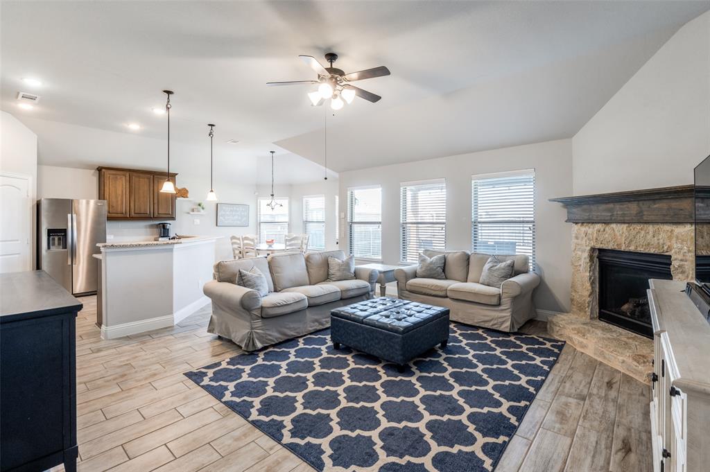 3011 Razorback Street Melissa, TX 75454 - Photo 4 of 25 a living room with furniture and a fireplace