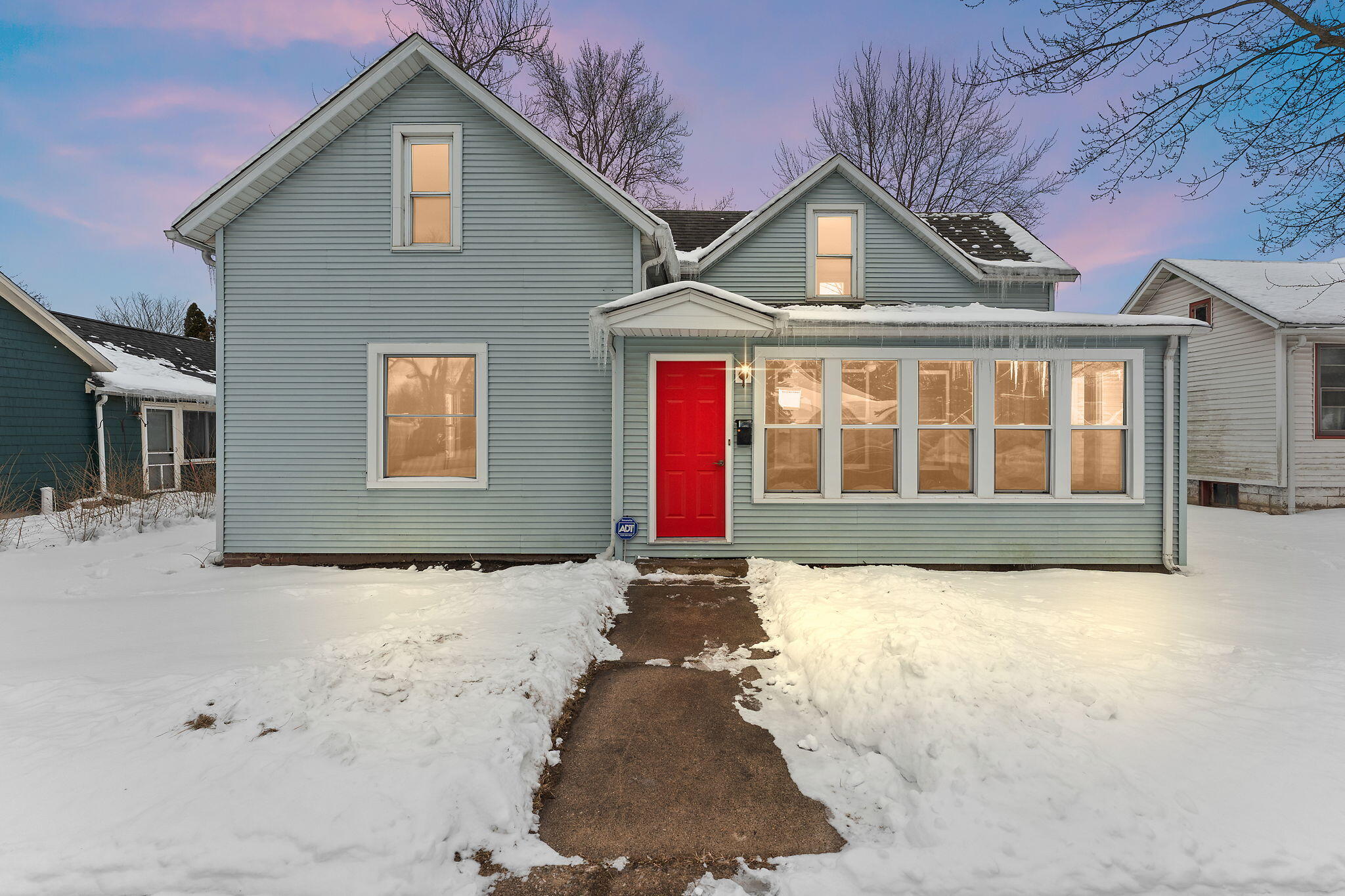 a view of white house with a yard