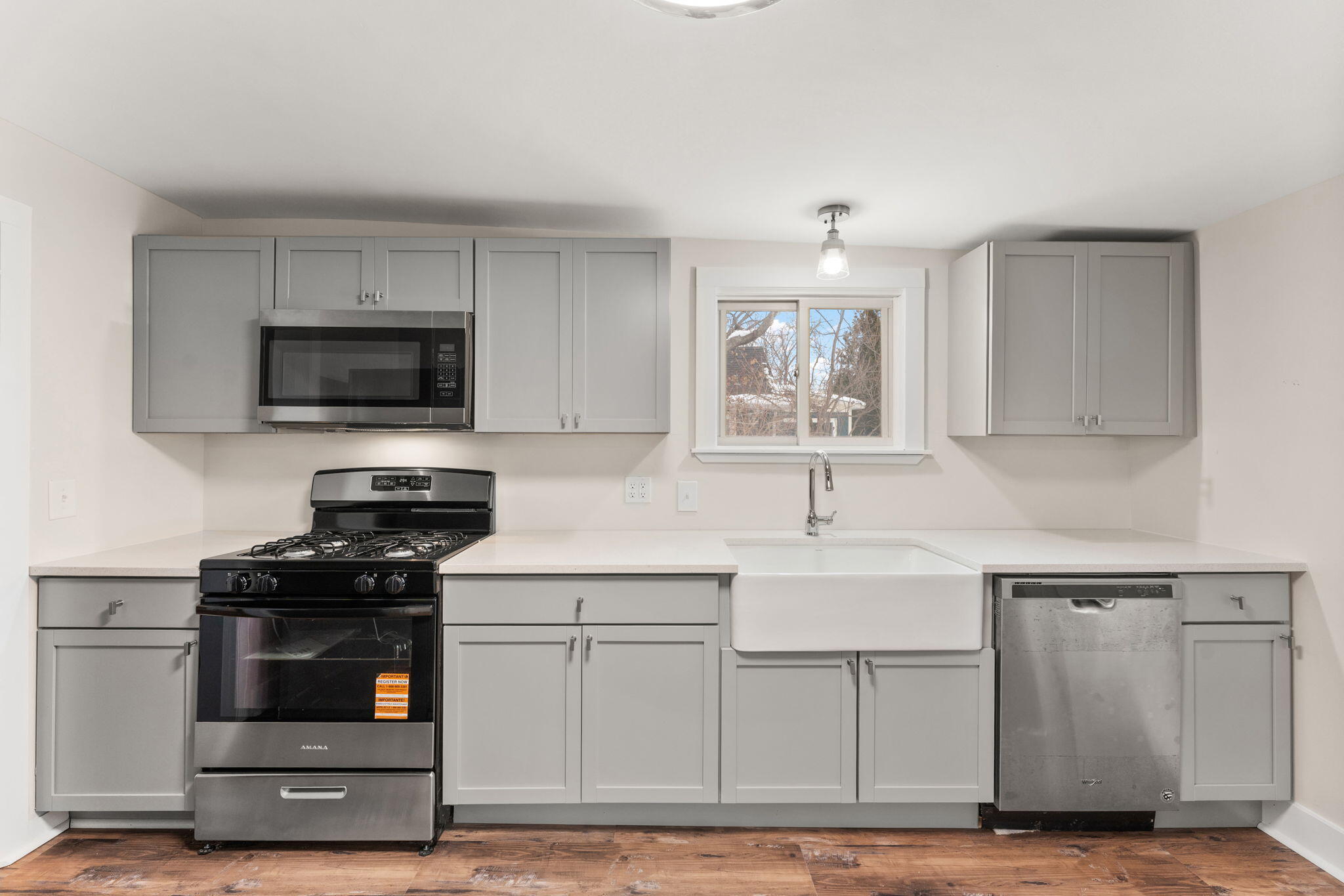 107 Franklin Street Porter, IN 46304 - Photo 11 of 22 a kitchen with white cabinets and appliances
