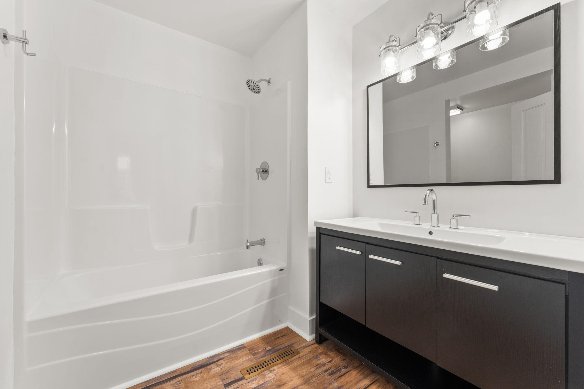 107 Franklin Street Porter, IN 46304 - Photo 12 of 22 a bathroom with a tub sink and mirror