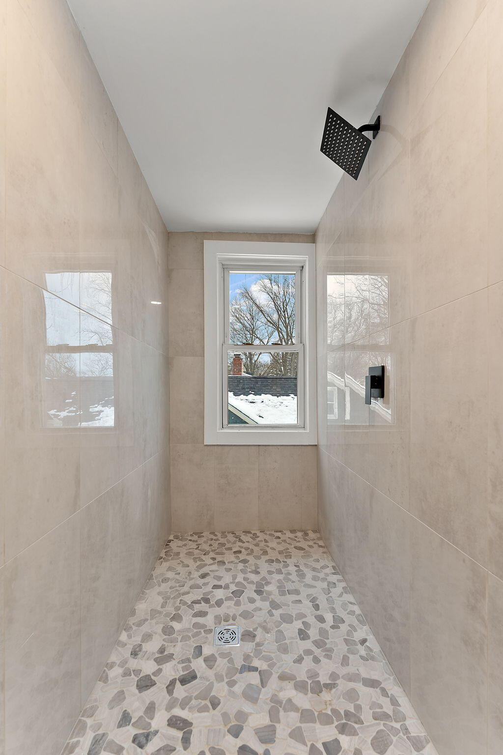 107 Franklin Street Porter, IN 46304 - Photo 15 of 22 a big room with wooden floor a exposed radiator and windows