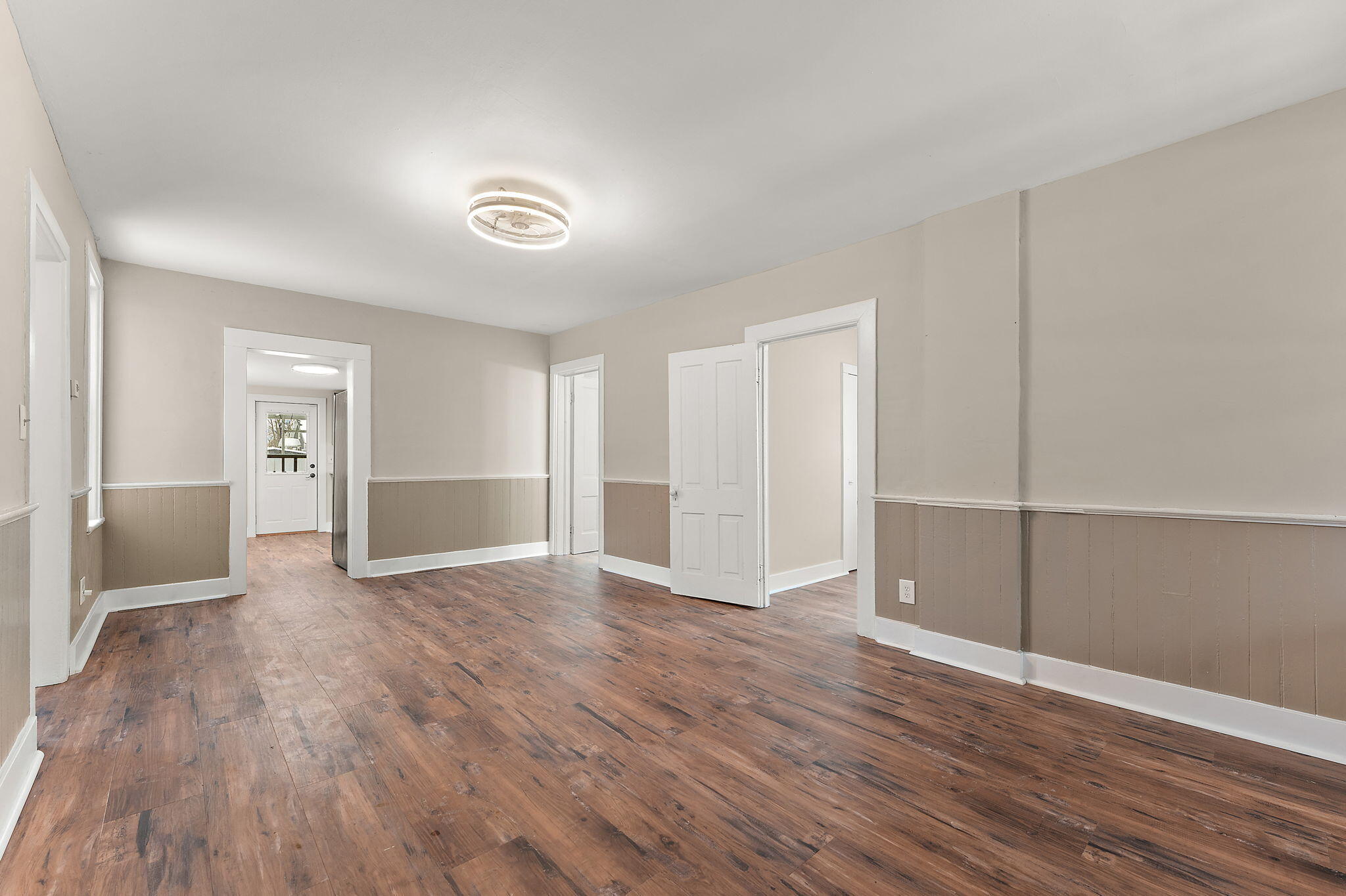 107 Franklin Street Porter, IN 46304 - Photo 5 of 22 a view of an empty room with wooden floor