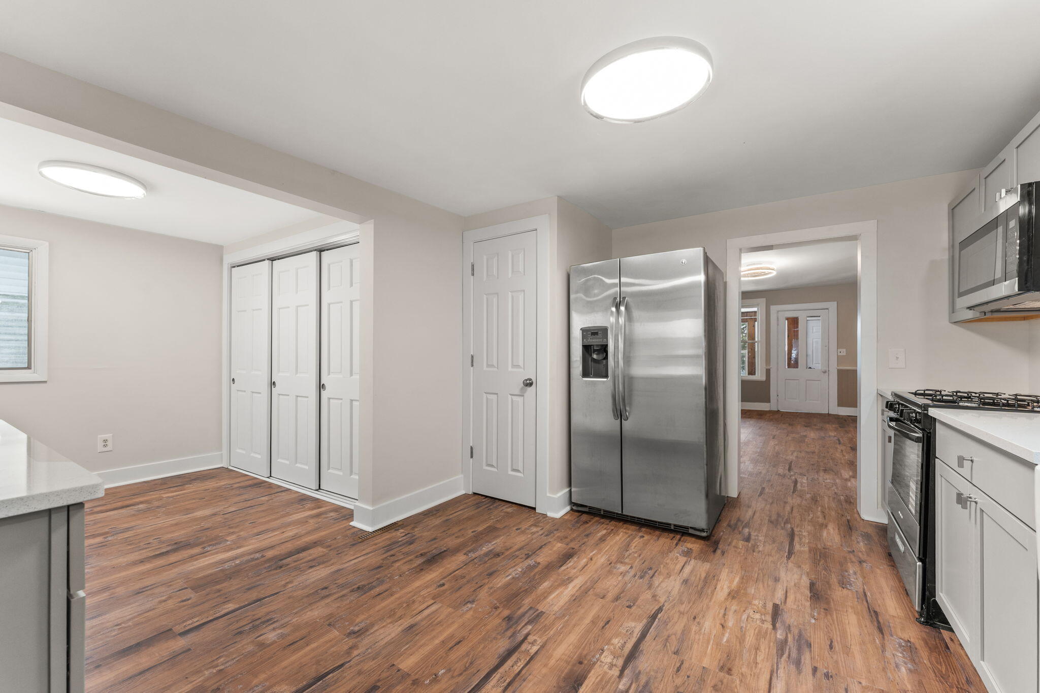 107 Franklin Street Porter, IN 46304 - Photo 9 of 22 a view of a kitchen cabinets wooden floor and a window