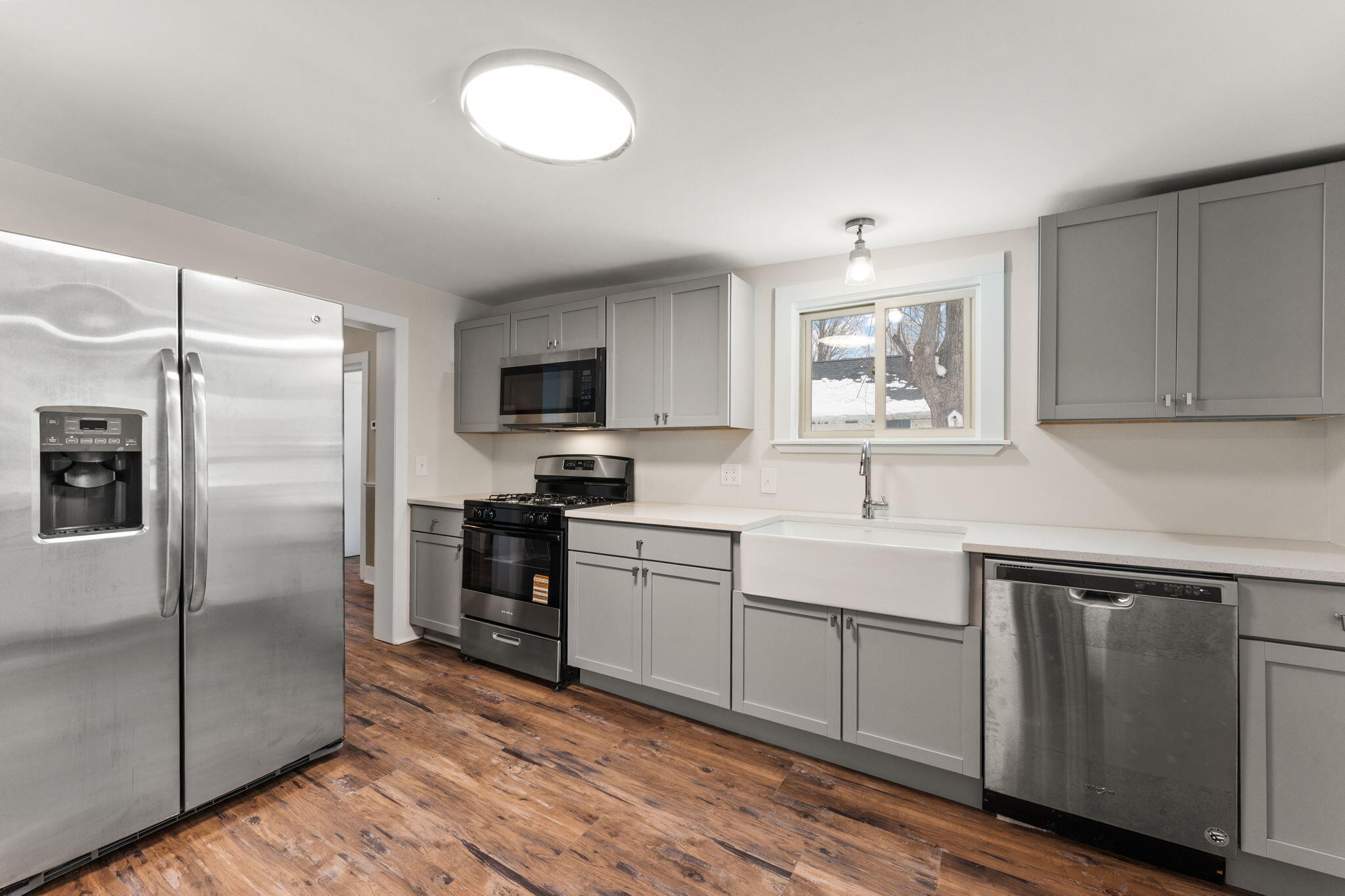 107 Franklin Street Porter, IN 46304 - Photo 10 of 22 a kitchen with a refrigerator stove and microwave