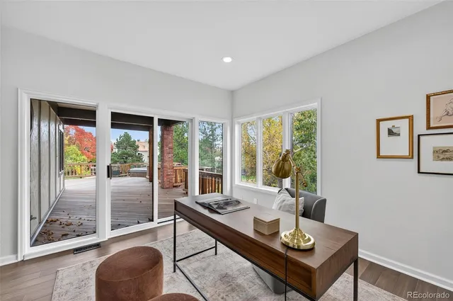 a living room with a couch and a floor to ceiling window