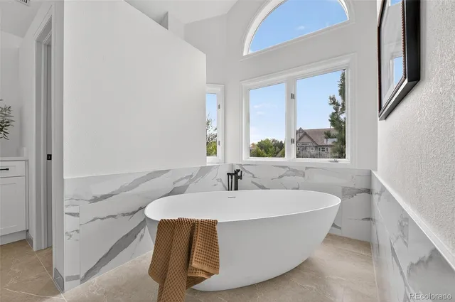 a bathroom with a sink toilet tub and shower