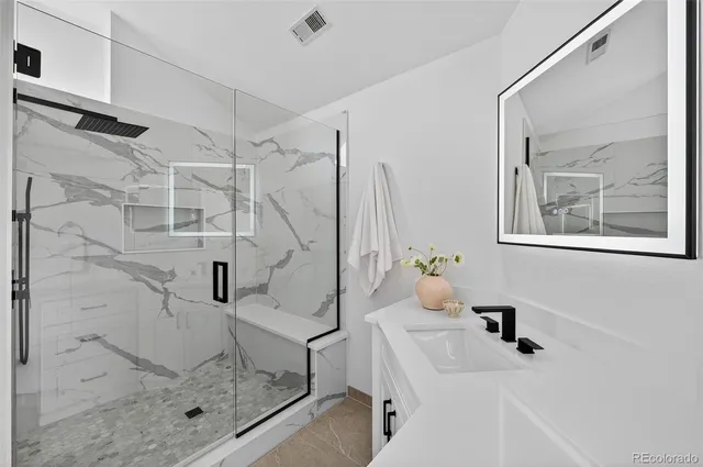 a view of a livingroom with a ceiling fan and window