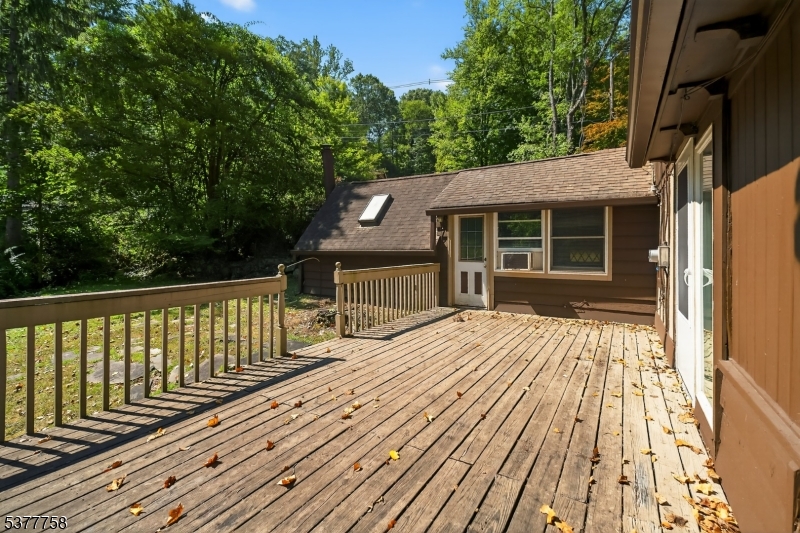 46 Glenside Trail Sparta, NJ 07871 - Photo 13 of 31 a view of backyard with deck and wooden floor