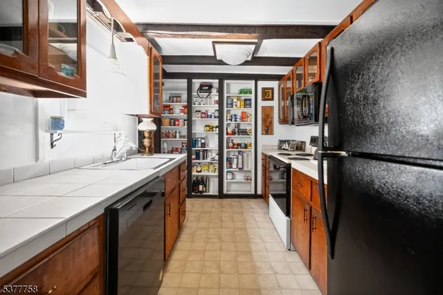 a bedroom with a bed and a mirror