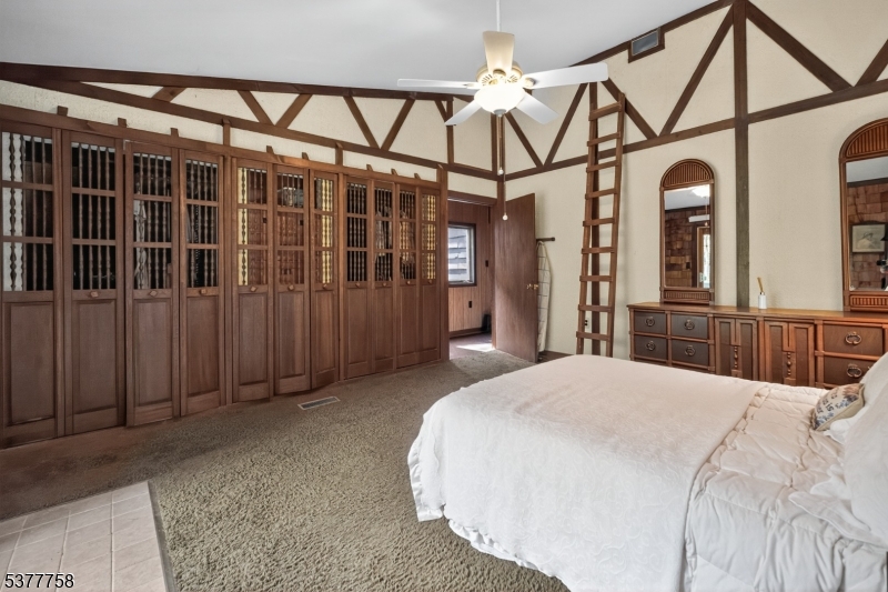 46 Glenside Trail Sparta, NJ 07871 - Photo 16 of 31 a bedroom with a bed and a mirror