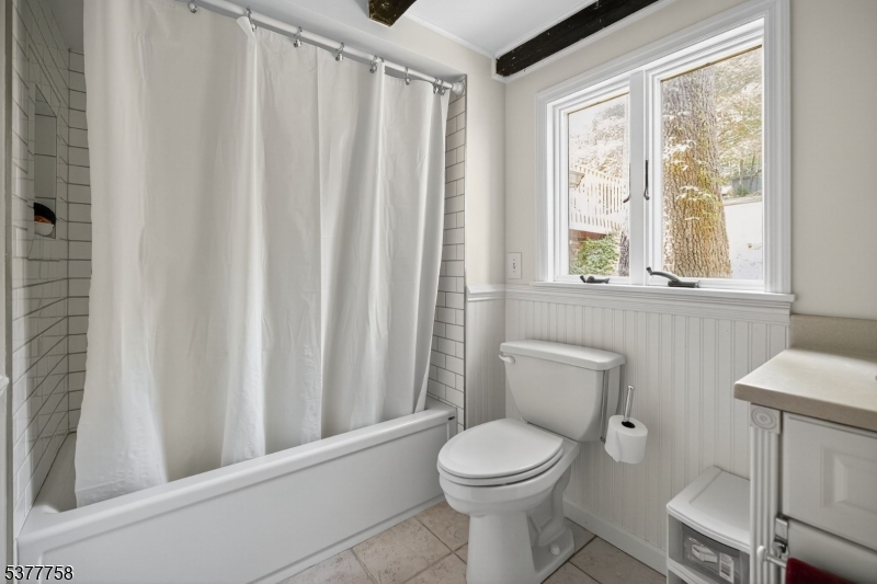 46 Glenside Trail Sparta, NJ 07871 - Photo 20 of 31 a white toilet sitting next to a bathroom sink and vanity