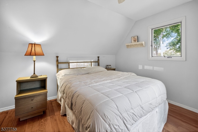 46 Glenside Trail Sparta, NJ 07871 - Photo 23 of 31 a bedroom with a bed and a night stand