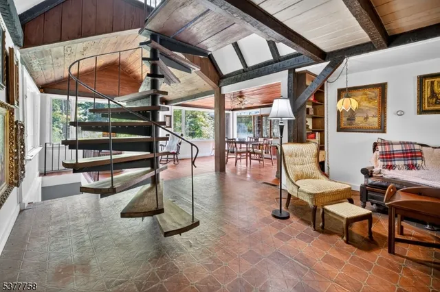 a living room with a fireplace and a flat screen tv