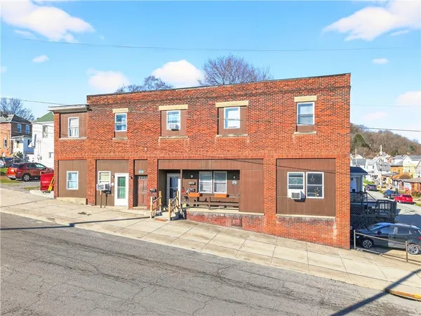 a view of a building with sitting area