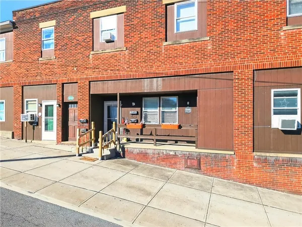 a kitchen with granite countertop a refrigerator and a stove