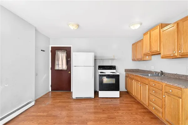 a kitchen with cabinets and stainless steel appliances
