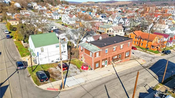 an aerial view of a house with swimming pool