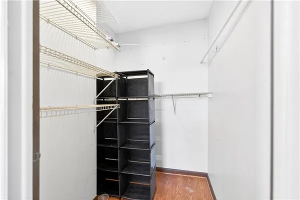 a bathroom with a granite countertop sink mirror vanity and bathtub