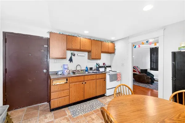 a bathroom with a sink toilet and a mirror