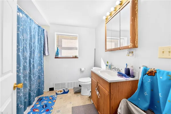 a bedroom with furniture and a window