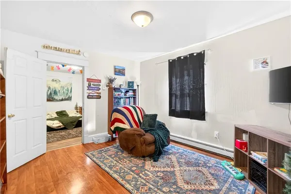 a bedroom with a bed and a book shelf