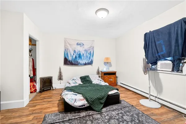 a bed room with a bed and a book shelf