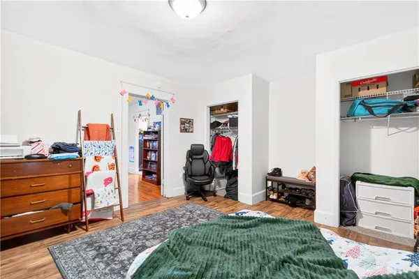 a living room with furniture a couch and dresser